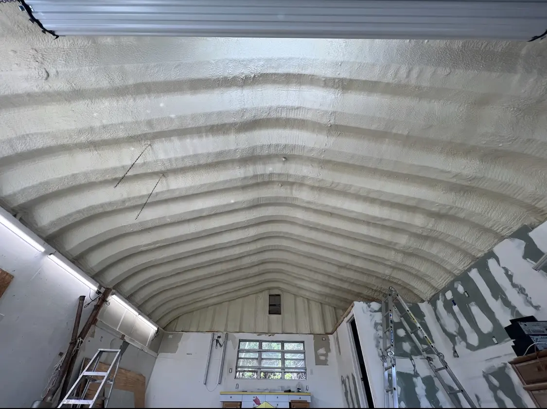 Spray polyurethane foam applied to the underside of a metal roof deck in Atmore