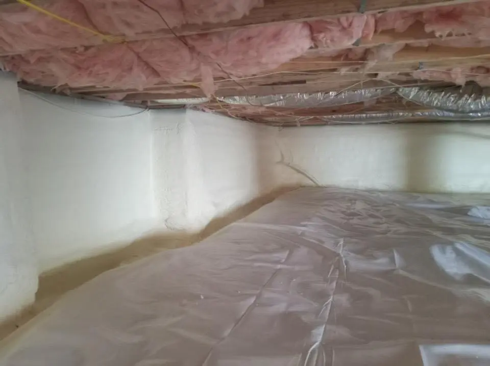 Crawl space encapsulation with closed-cell spray foam for Commercial Roof Restoration in Atmore